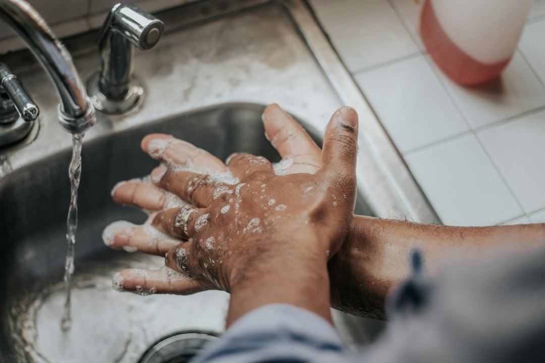 Hands being washed with soap