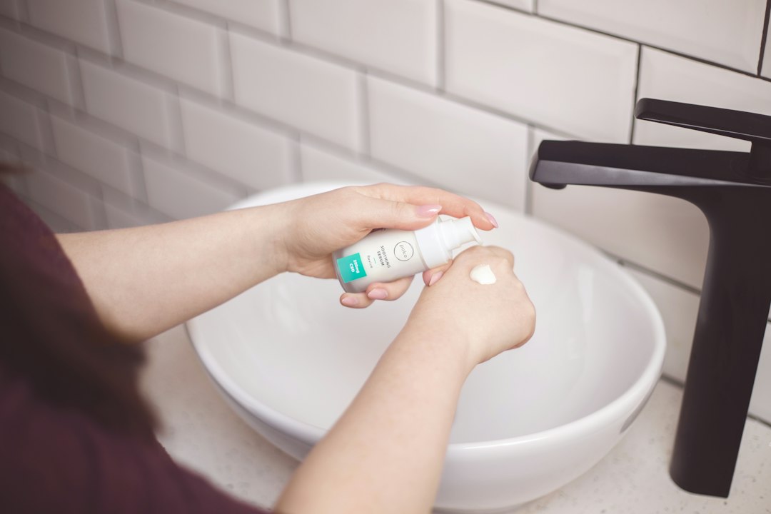 Moisturizing routine at a bathroom sink
