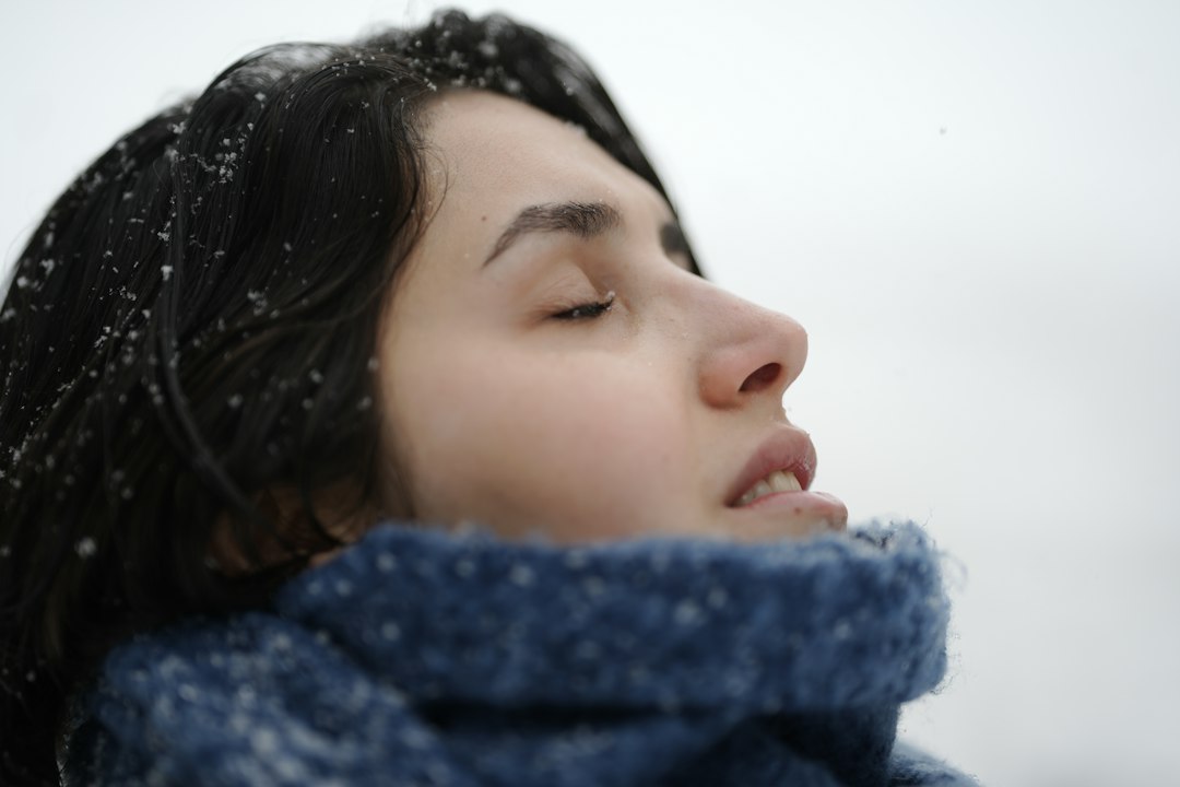 Woman outdoors in cold snowy weather